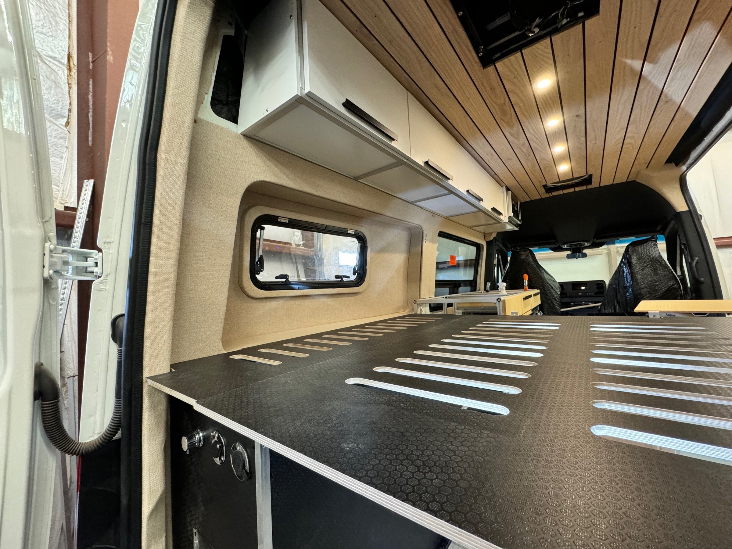 Bed platform and overhead cabinets