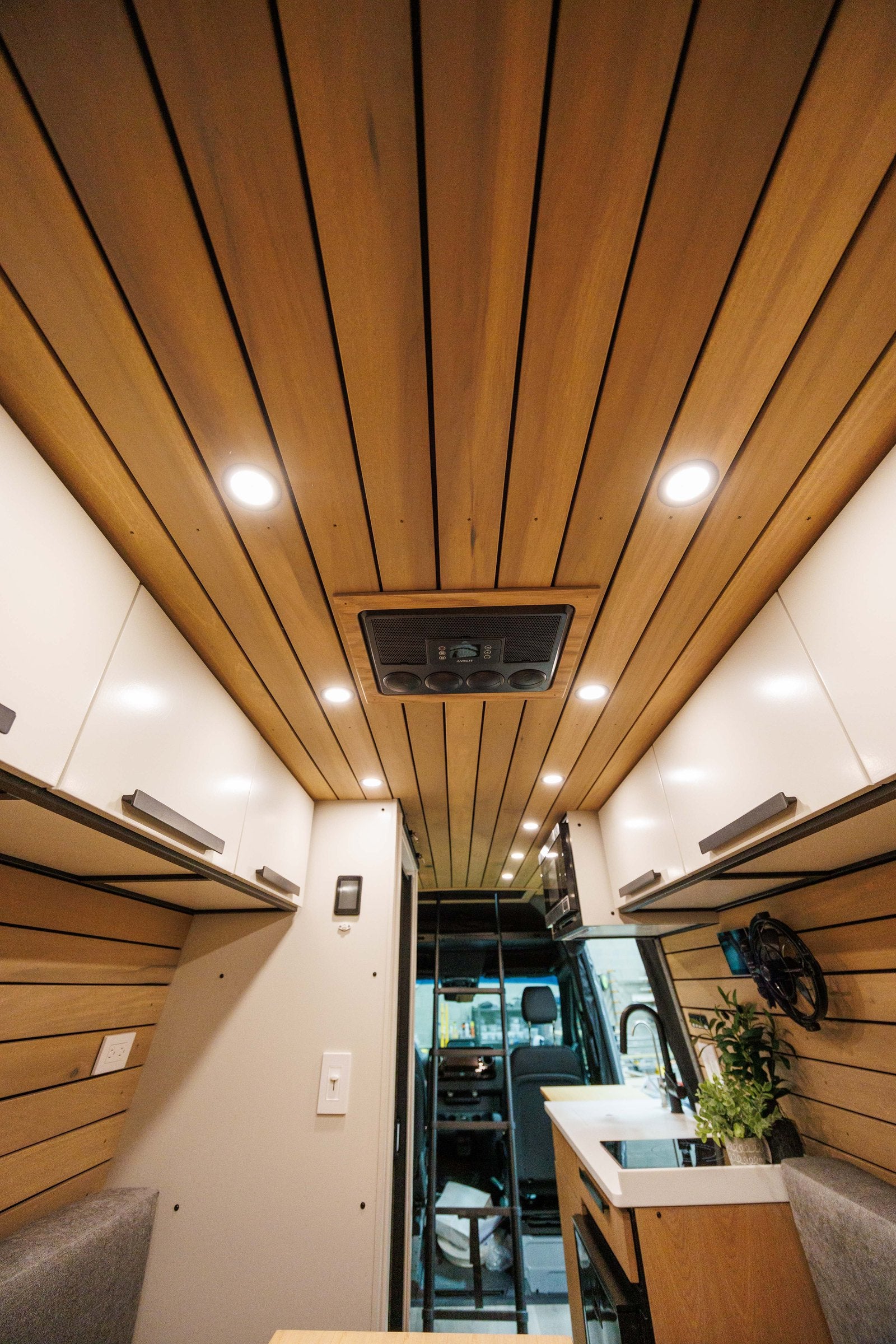 Wood-slat ceiling and lighting