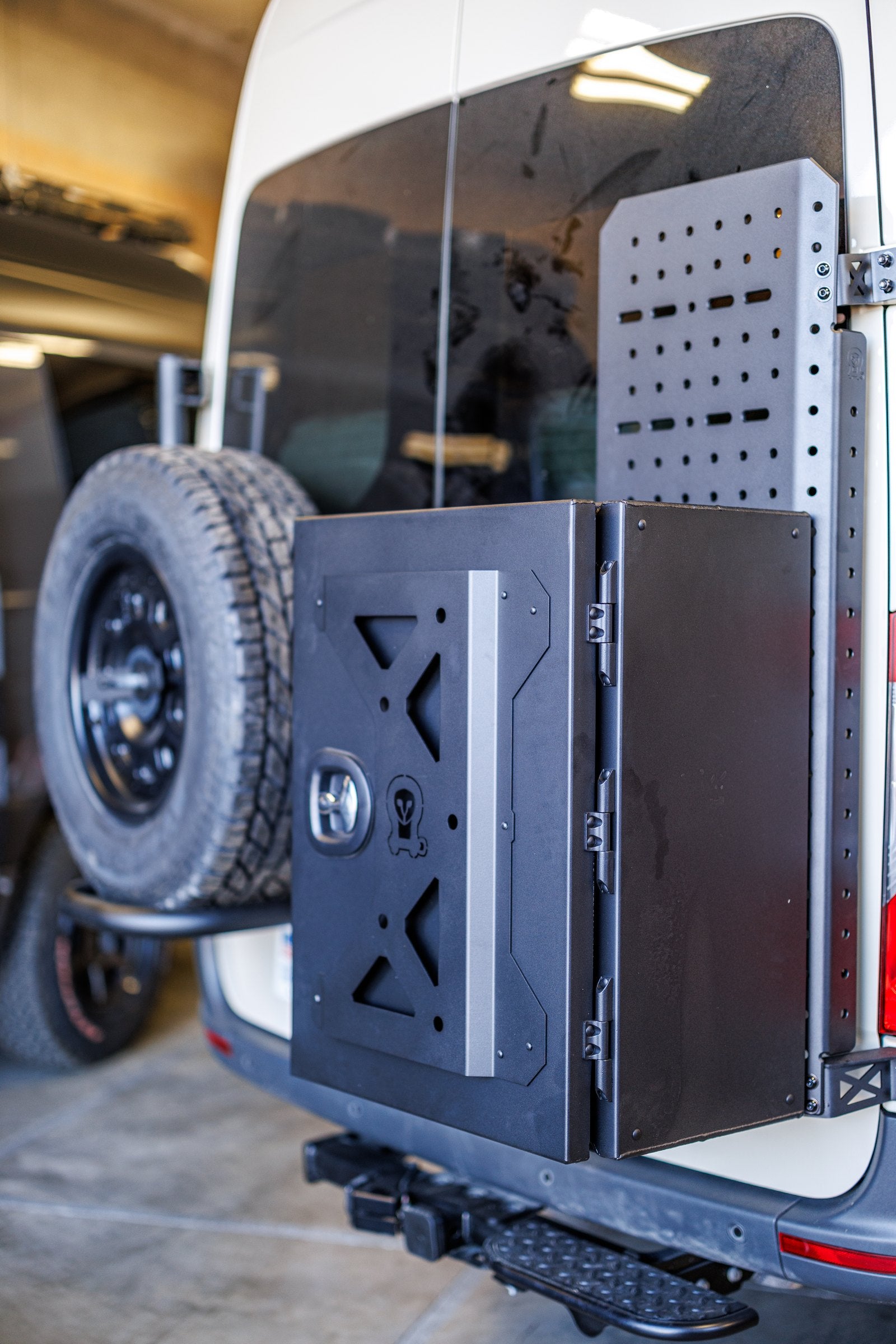 Rear spare tire carrier and storage box